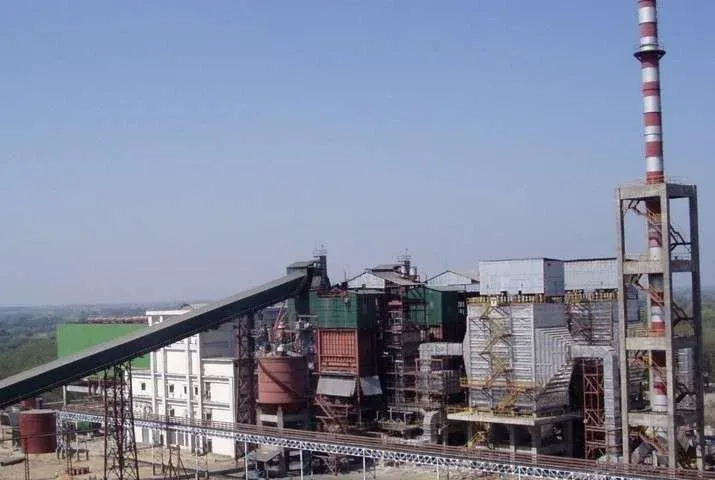 Power generation facility with chimney and steel framework infrastructure