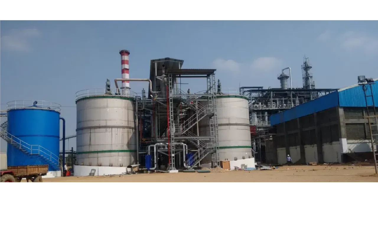 Industrial facility with large storage tanks and steel piping infrastructure