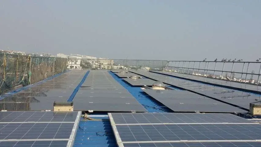 On-grid solar panel system on building rooftop for clean energy generation